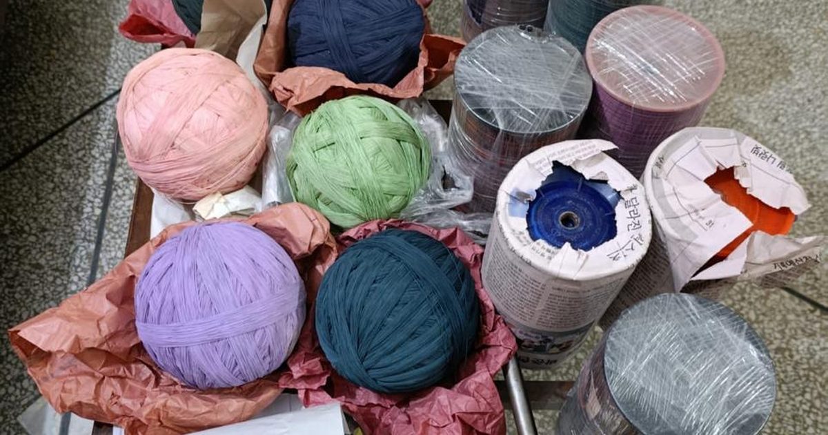 Wound pinnay and spools of cotton kite string, the material a maker's license covers