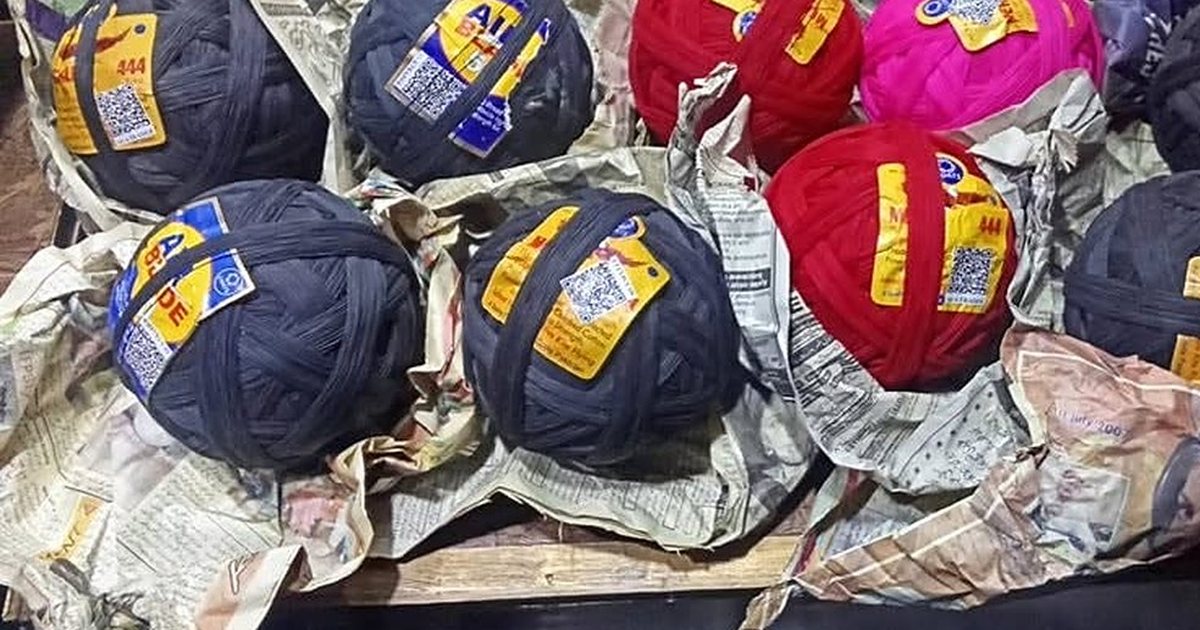 Wound cotton pinnay in a Lahore shop, each ball carrying its printed label