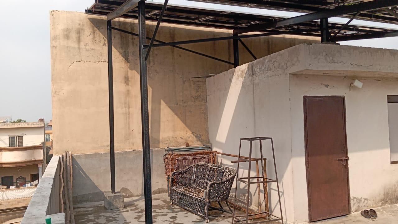Azam Garden rooftop, the shaded frame and the stair door